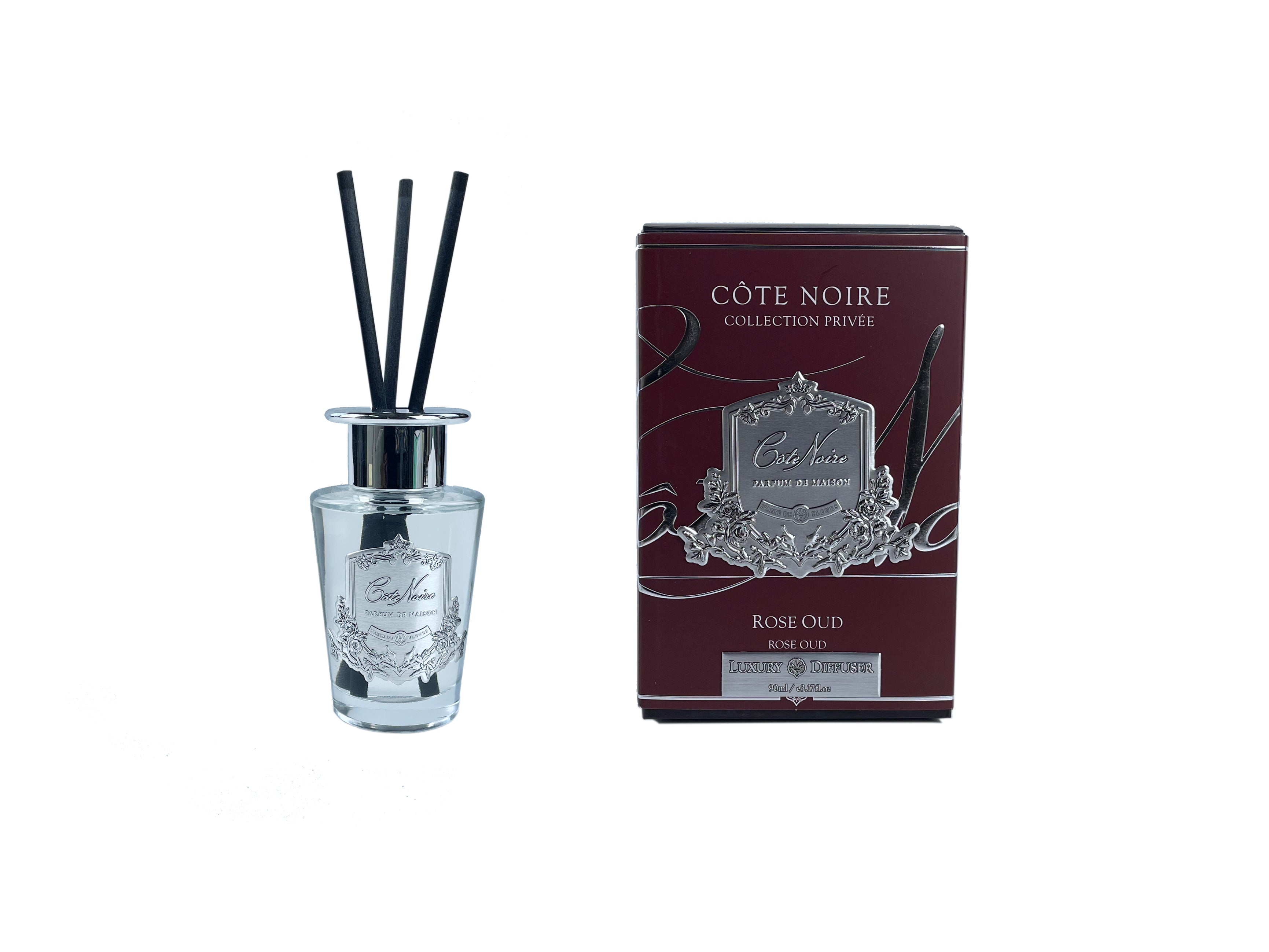 schwarze duftstaebchen im glas mit silbernem deckel und emblem. dunkelrote verpackung. rose oud 90ml.