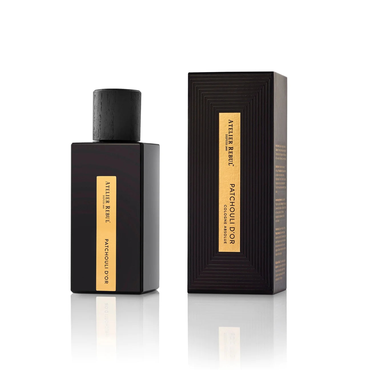 vor weisem hintergrund steht die edle schwarze glasspruehflasche mit goldenem etikett daneben die verpackung im gleihen design