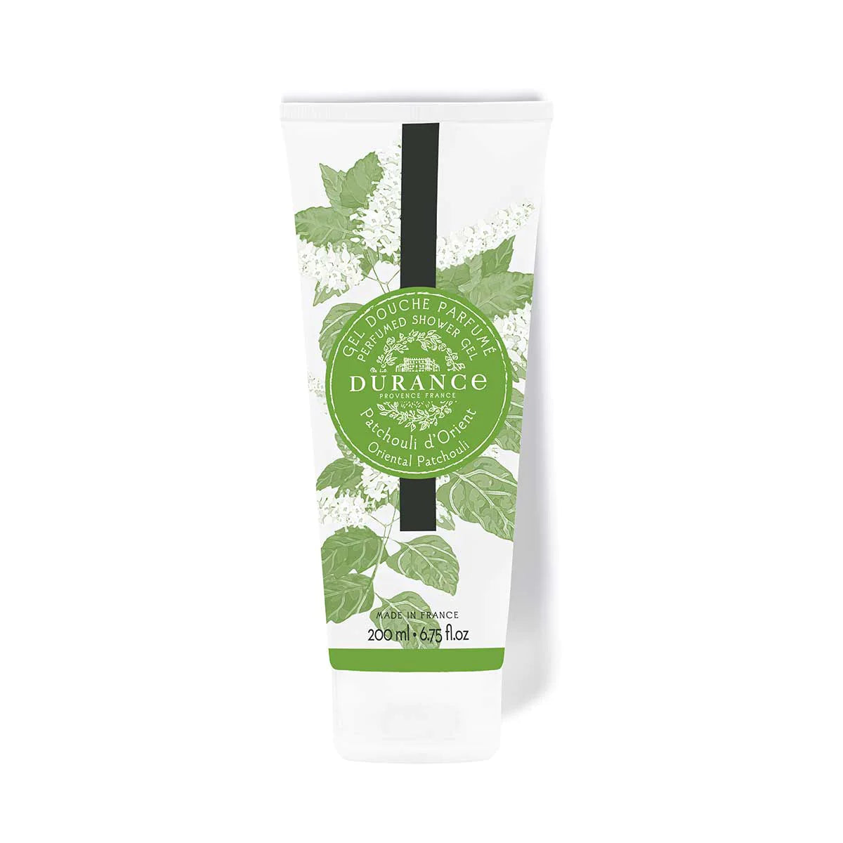 duschgel patchouli weisse tube mit gruenen graesern und schraubverschluss vor einem weissen hintergrund