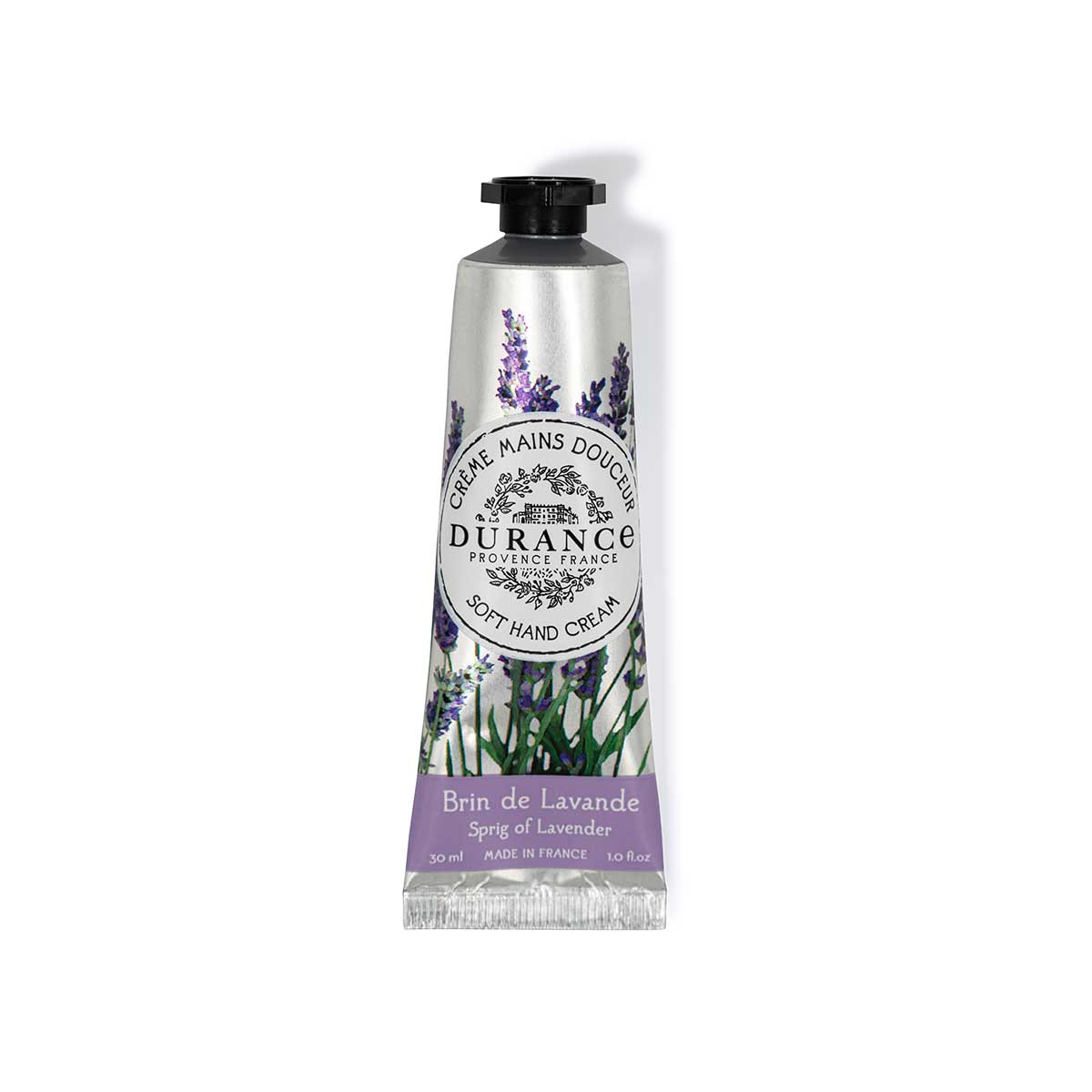 kleine silberne mit lavendel bedruckte handcremetube schwarzer schraubverschluss vor weissem hintergrund