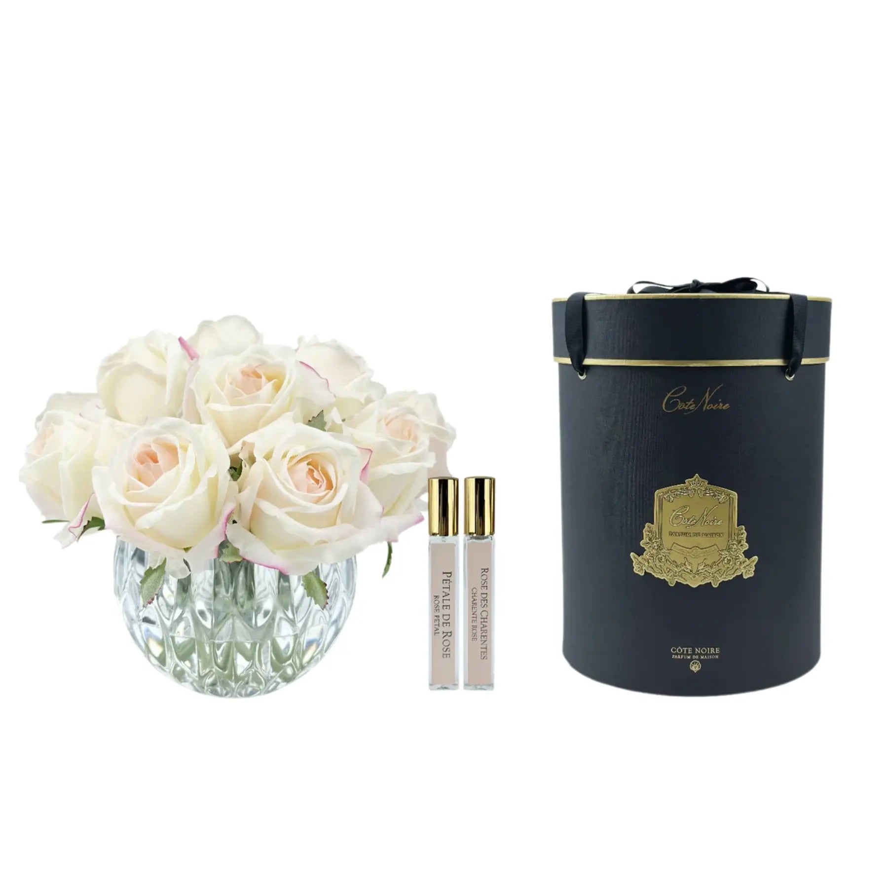 Zart roséfarbene Duftblume in runder Vase mit zwei Parfum-Sprays und luxuriöser Geschenkbox – edle Geschenkidee im französischen Stil