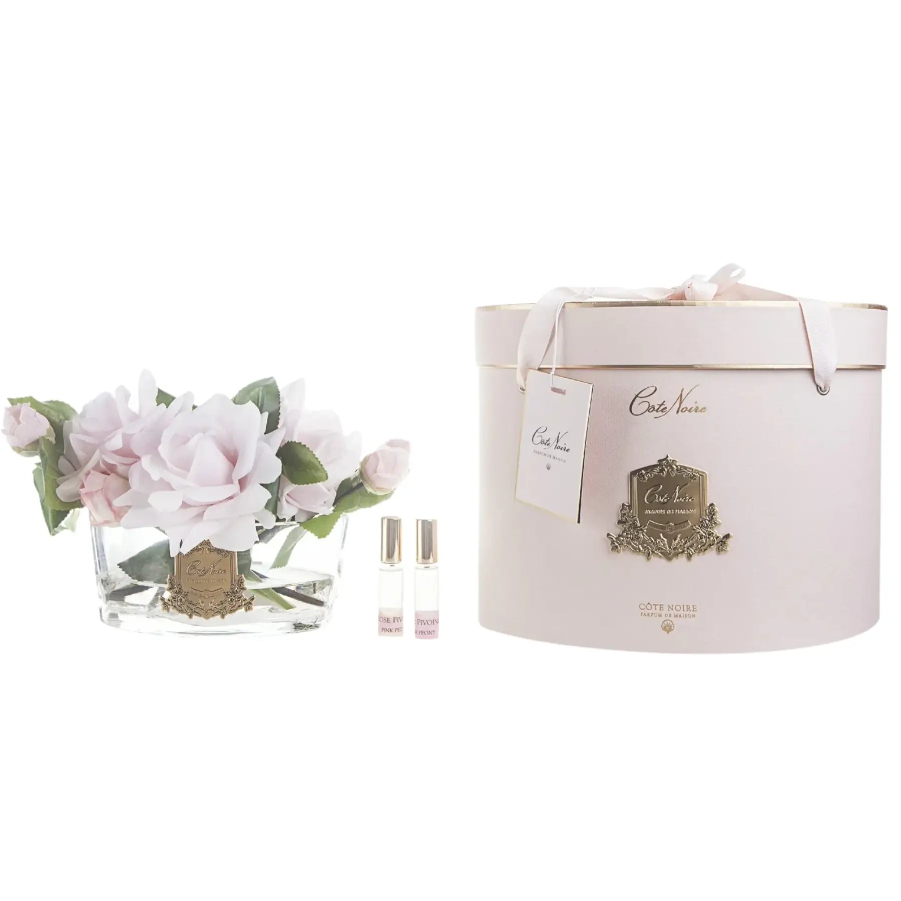 Exklusive Wohnaccessoires: Duftblume mit zartrosa Rosen in eleganter Geschenkverpackung