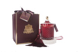 cote noire grand art duftkerze in dekorativem glas, daneben verpackung mit geschenkschleife, rot und gold.