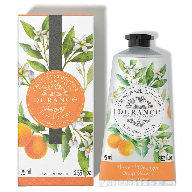silberne mit orangen bedruckte schraubtube daneben die dazugehoerige verpackung vor weissem hintergrund