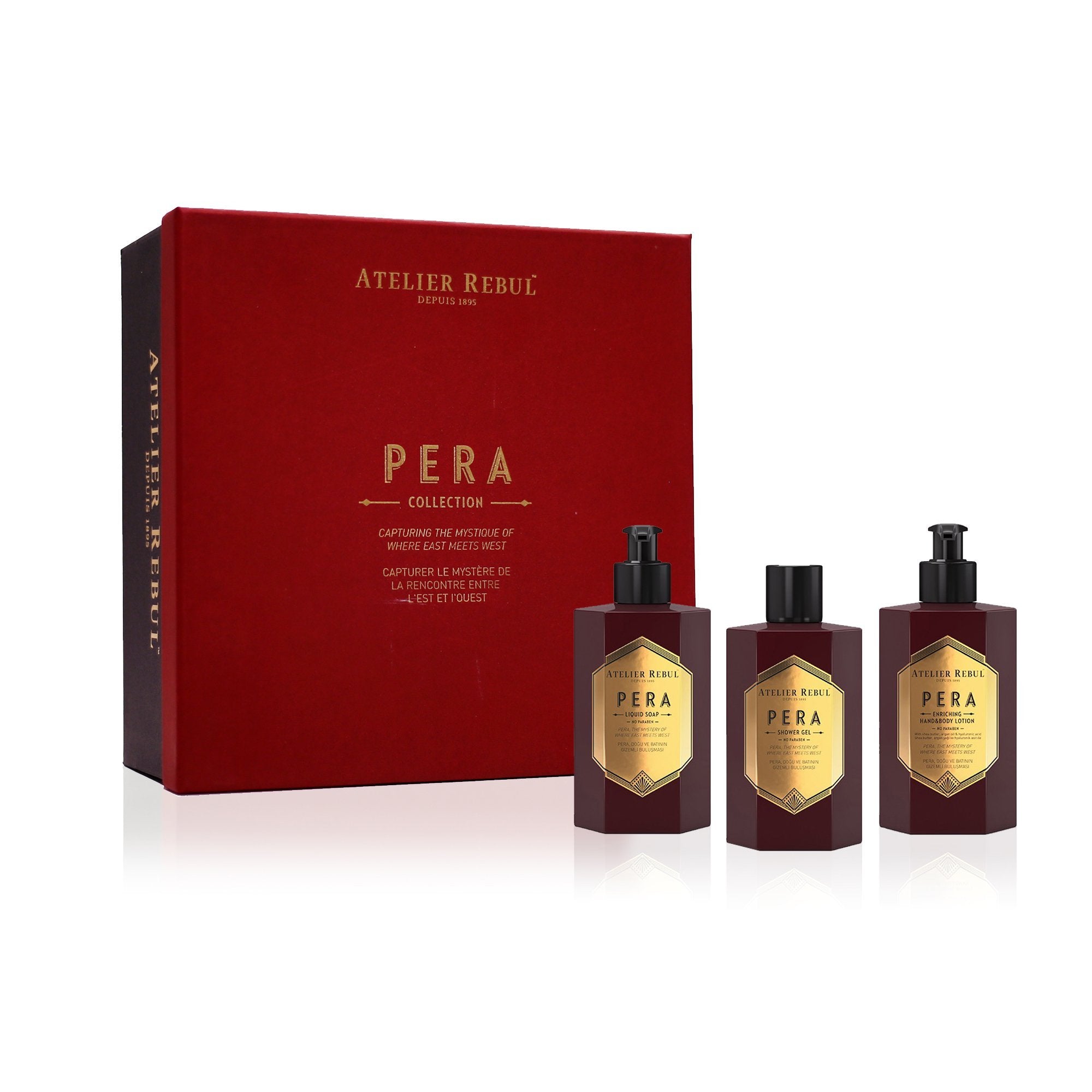 pera geschenkbox mit rotem deckel und schwarzer box neben set aus drei pera flaeschchen. weisser hintergrund.